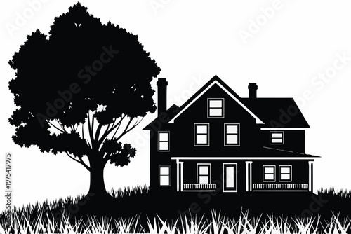 A classic two story house with a tree sits on a grassy hill