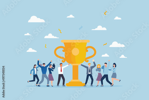 Celebrating success a team gathers around a large golden trophy