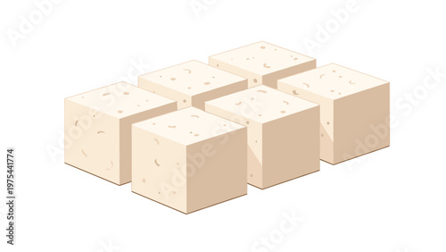 Several uniform cubes of light-colored food like tofu or feta cheese arranged in a neat group on a white background.