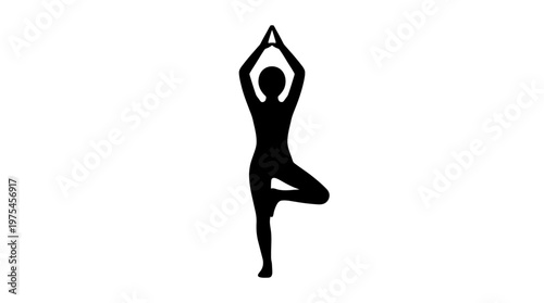 A woman practices yoga in a serene environment with tree pose