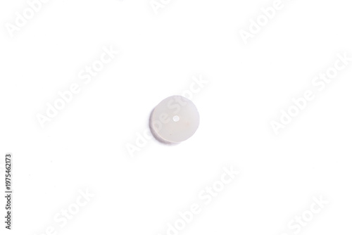 Single flat white plastic washer or spacer on png background.