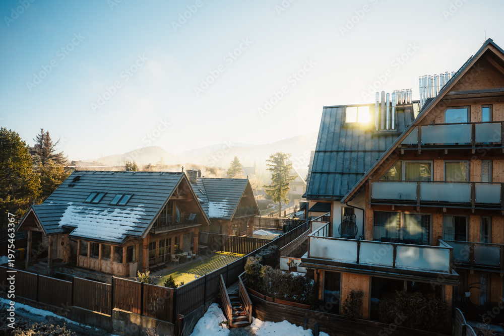 Fototapeta premium Traditional mountain houses in Zakopane in winter landscape in Tatra Mountains in Poland