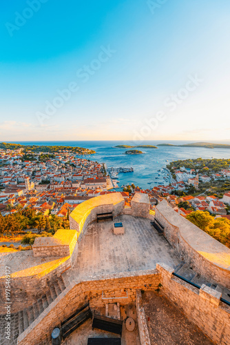 Canvas Print Stunning sunset over Hvar town and Pakleni Islands viewed from the medieval Spanish Fortress, golden hour over the Adriatic sea, Croatia