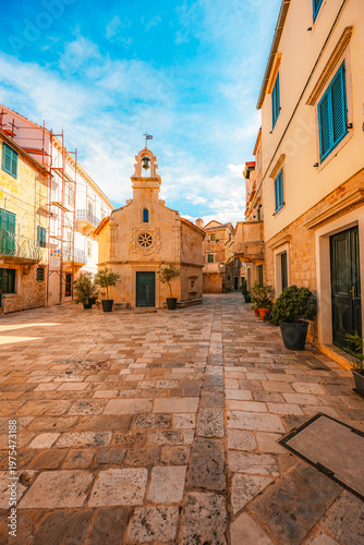 Valokuva Jelsa town on Hvar island, with traditional Dalmatian stone architecture and boats moored in the harbor, Croatia