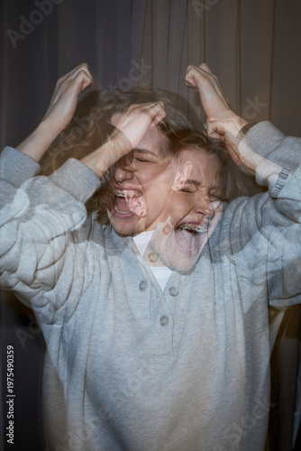 фотографія Vertical of Caucasian young adult woman expressing intense emotion with hands ra