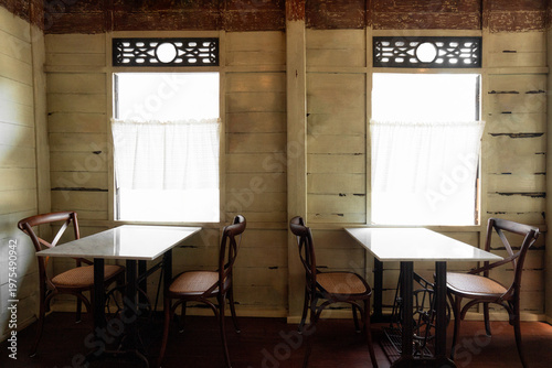 Vintage Cafe Interior with Empty Tables and Window Light
