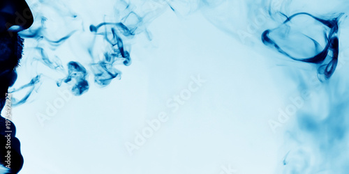 Light blur background with cyan, blue fog floating in the air.