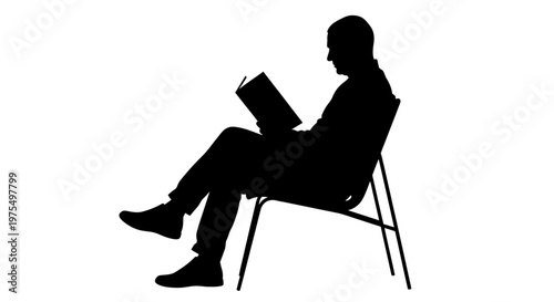 Man sitting in chair reading book.