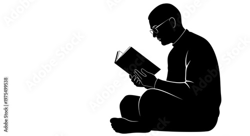 Man sitting and reading a book.