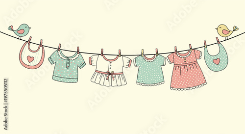 Row of cute baby clothes including dresses and shirts hanging on a laundry line between two little singing birds.