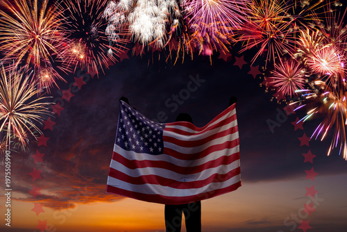 National flag of United States of America in sky with fireworks independence day