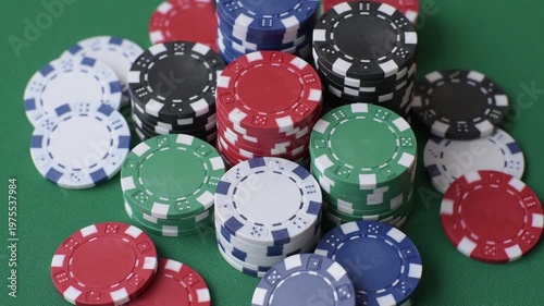 Multicolored casino chips as a conceptual backdrop for gambling games like poker, blackjack, or baccarat. Multicolored casino chips as a backdrop for your design