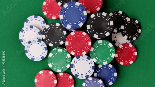 Multicolored casino chips as a conceptual backdrop for gambling games like poker, blackjack, or baccarat. Multicolored casino chips as a backdrop for your design