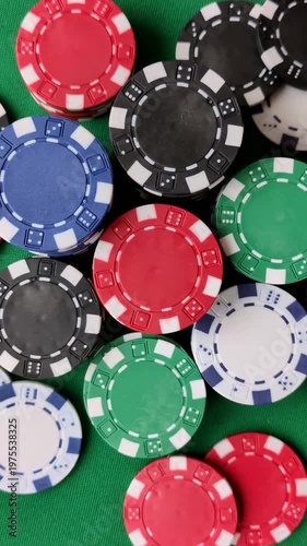 Multicolored casino chips as a conceptual backdrop for gambling games like poker, blackjack, or baccarat. Multicolored casino chips as a backdrop for your design