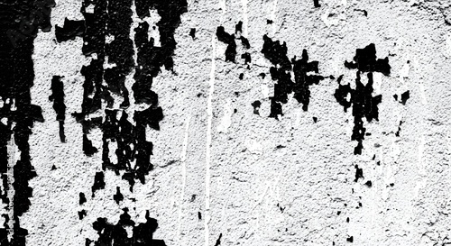 Black and white abstract wall texture with peeling paint pattern.