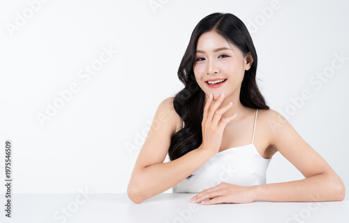 Beautiful portrait of young asian woman with healthy facial and body skin and glowing makeup for advertise skincare product.