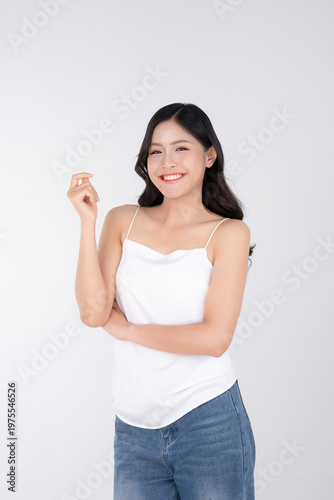 Cheerful of portrait asian woman standing on white background with healthy body facial skin and glowing makeup, for advertisement skincare and cosmetics concept.