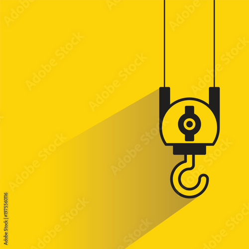 pulley crane hook icon on yellow background