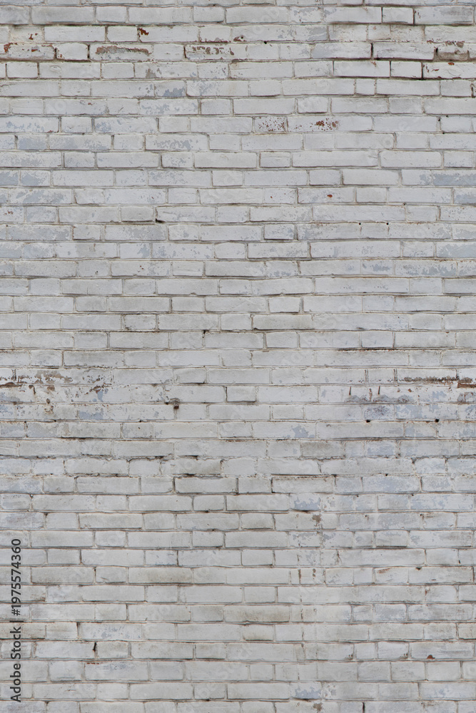 Obraz premium white brick wall texture background with peeling paint and wear