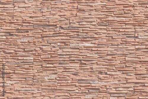 Φωτογραφία Stone wall texture with irregular stacked bricks in outdoor daylight