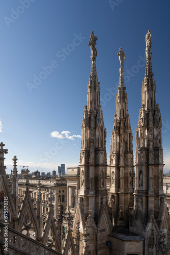 Milan's financial district and statues of Duomo of Milan