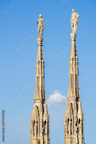 Details of marble statues of Milan Cathedral at sunny day