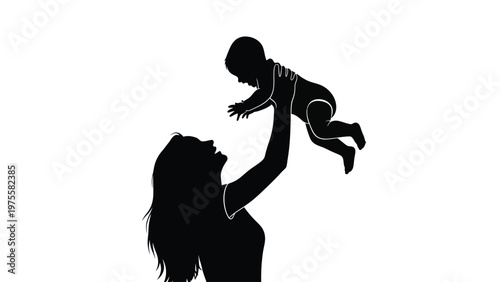 Loving mother lifting her small baby into the air with joyful expression silhouette