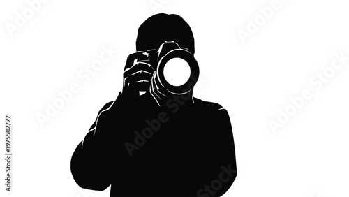 Photographer silhouette holding camera isolated on a solid white background lens