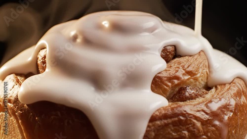 Close-up of fresh cinnamon roll pastry with thick white icing pouring over the top, ideal for bakery menus, dessert advertising, breakfast concepts, and food packaging design for advertising