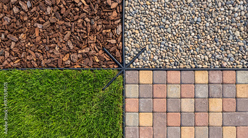 Overhead view of garden design with four landscaping textures: bark mulch, decorative pebbles, green grass.