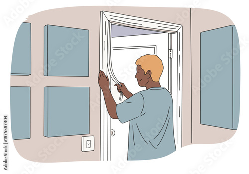 A man installs acoustic panels in a home studio doorway, creating a soundproof space. Modern, DIY design. Focus on the action and setup.