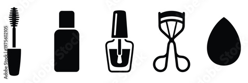 Collection of essential makeup and beauty tools including mascara, liquid foundation bottle, nail polish, eyelash curler, and makeup sponge, perfect for cosmetic product promotion and