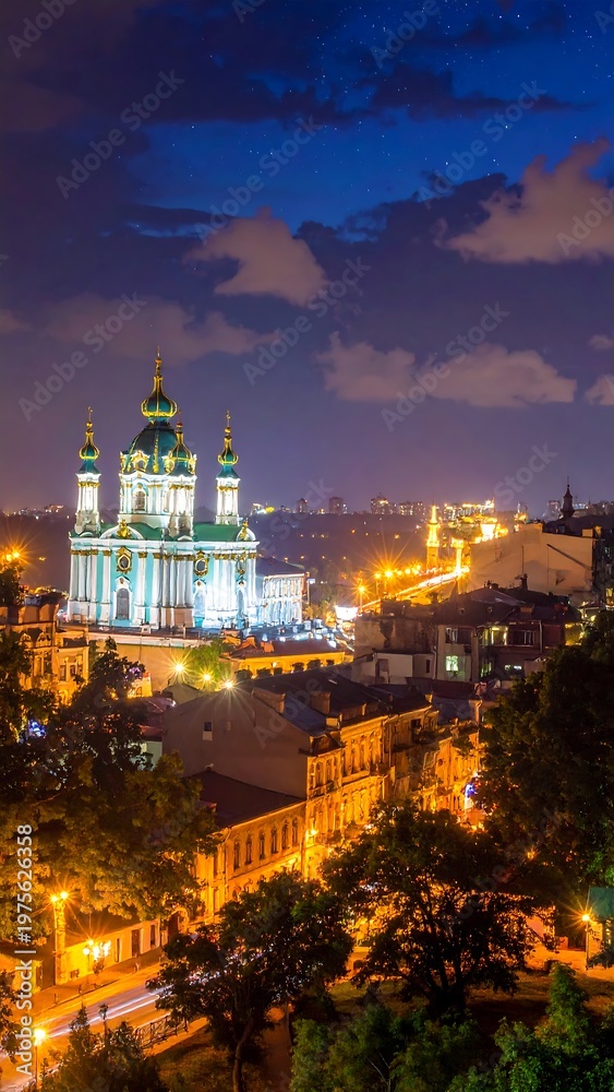 Obraz premium A nighttime cityscape with a large illuminated church