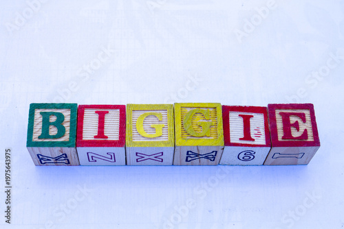 The word biggie displayed visually on a clear background with copy space