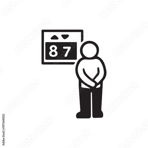 A person patiently waiting for their turn as a digital number eighty seven illuminates the display