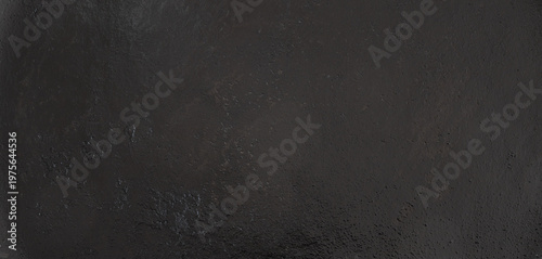 dark black cast iron surface texture with rough grainy metallic pattern and aged weathered industrial material details