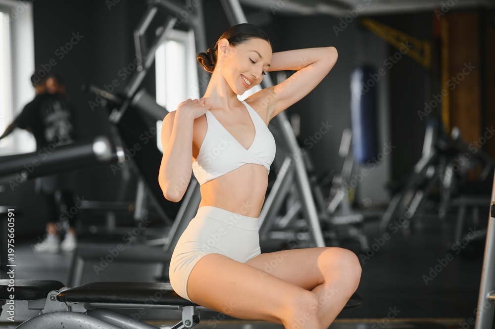 Fototapeta premium Sporty woman relaxing after gym workout