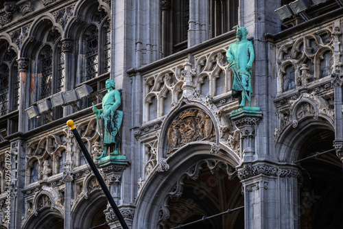 Gothic cathedral facade with patinated statues and stone tracery