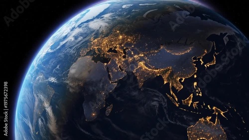 View of Earth from space at night showing city lights illuminating continents, global connection and atmospheric glow over the horizon of the planet.