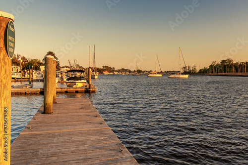 Bild auf Leinwand view of the historic boardwalk and waterfront of downtown Georgetown at sunset