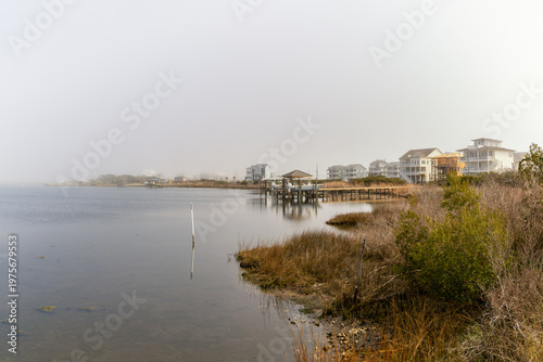 view of homes along Alligator Bay on a foggy winter morning in North Topsail Beach