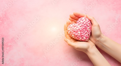 Heartfelt mother day gift hands holding a beautiful pink heart shaped treat for a loving celebration