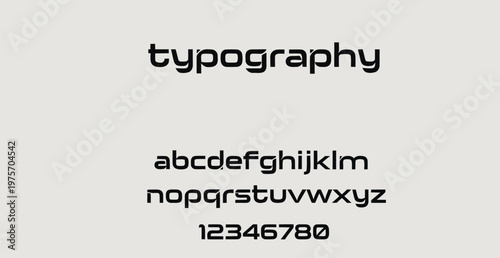 A clean and modern typography design featuring a simple alphabet and numbers on a light gray background