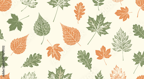 Seamless autumn pattern of various leaf prints in muted orange and green tones on a cream background featuring maple and oak leaves.