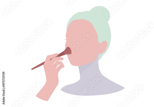 Woman applying makeup with a brush to her nose for a natural and radiant finish