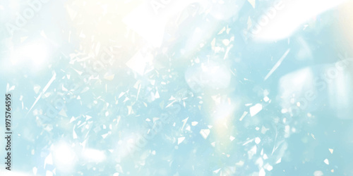 A dreamy abstract background featuring soft light blue tones and scattered shimmering particles