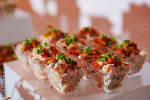 Catering service at a party with various food dishes on display
