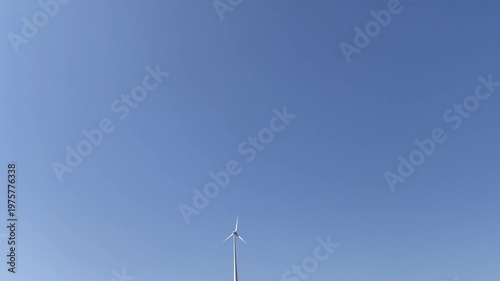  Single Wind Turbine Against Clear Blue Sky Minimal Renewable Energy Concept