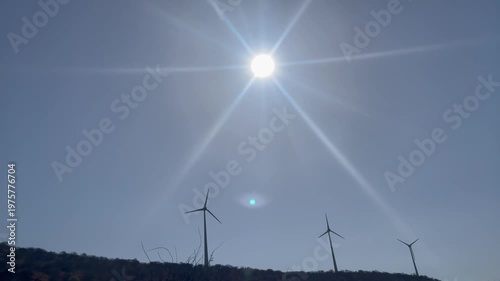 Wind Turbines Under Bright Sun  Renewable Energy Landscape with Clear Sky