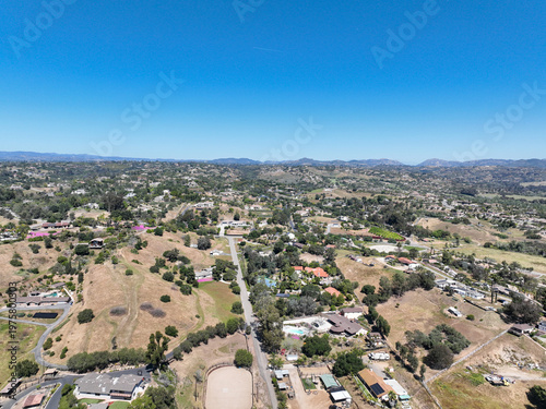 Aerial view of Fallbrook, Rainbow Crest, Rainbow Ridge with big mansion and green valley, San Diego County California